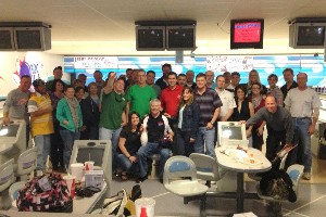 More than 40 industry and government bowlers join together in March to raise scholarship funds for the chapter, including Bill McKnight (c), U.S. Naval Supply Systems Command Business Systems Center, Mechanicsburg Naval Support Activity, who bowled a perfect score.